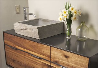 carved stone sink on steel vanity